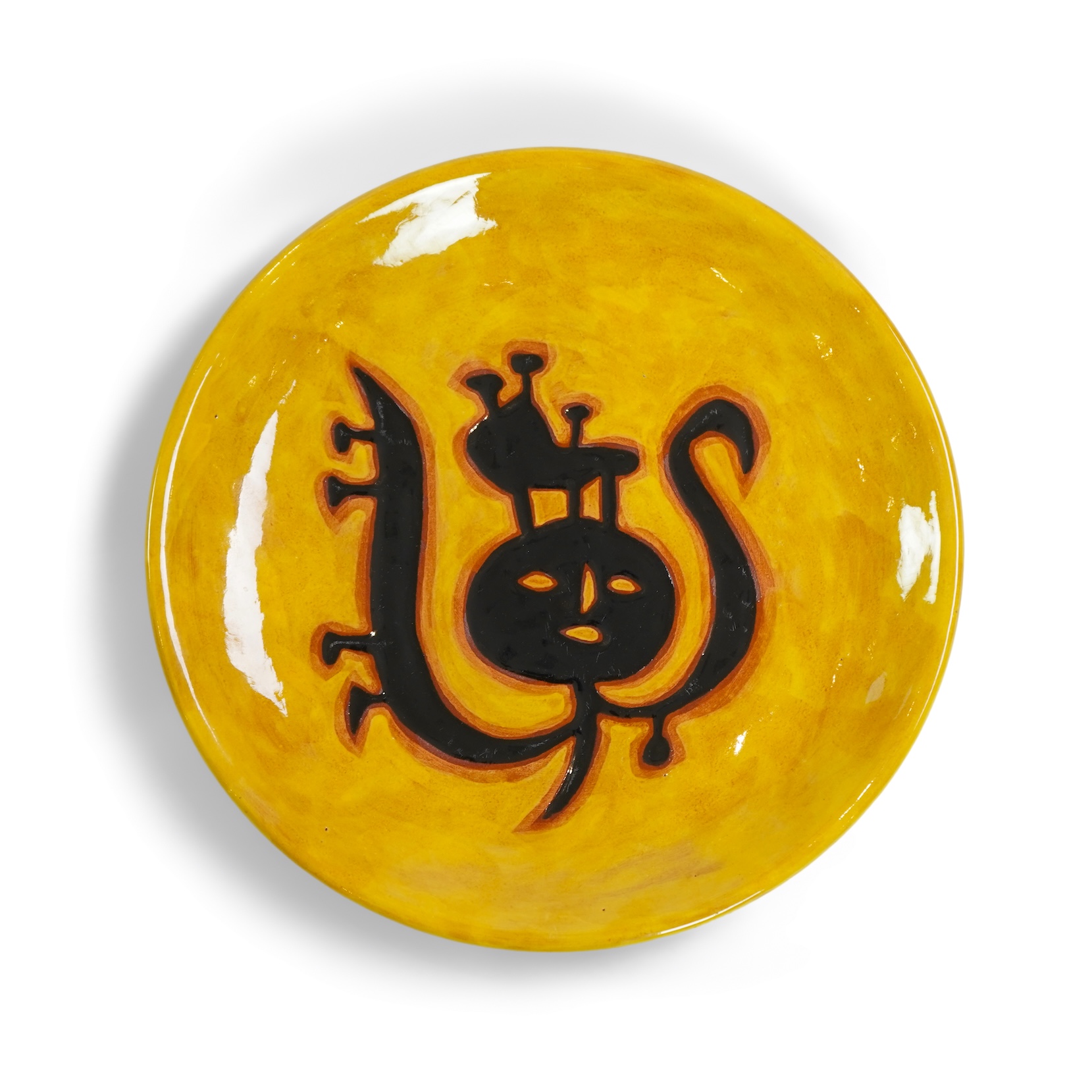 Jean Lurçat (1892-1966): A yellow glazed earthenware plate, decorated with a stylised central figure